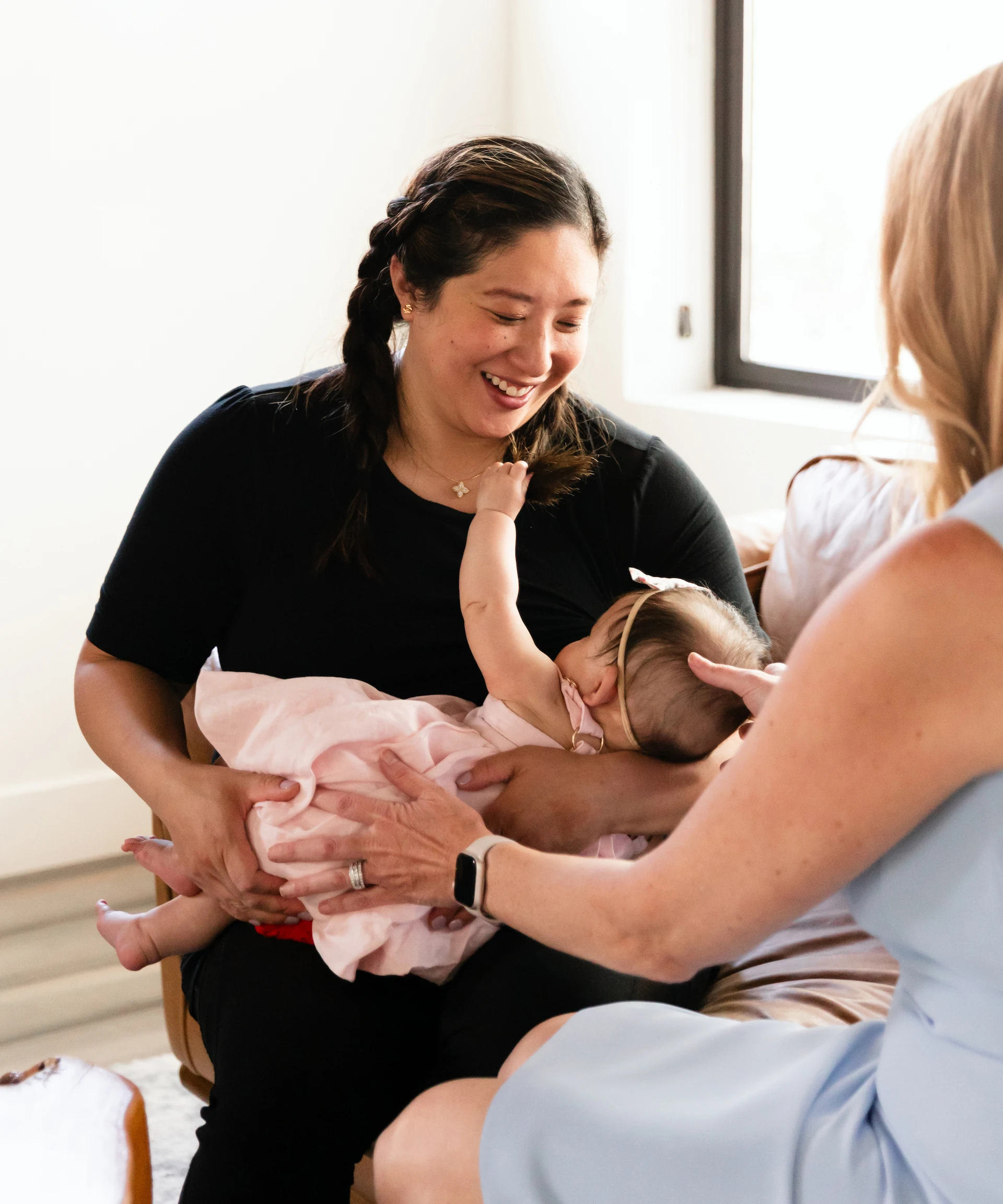 baby being nursed by mother and dr thuet