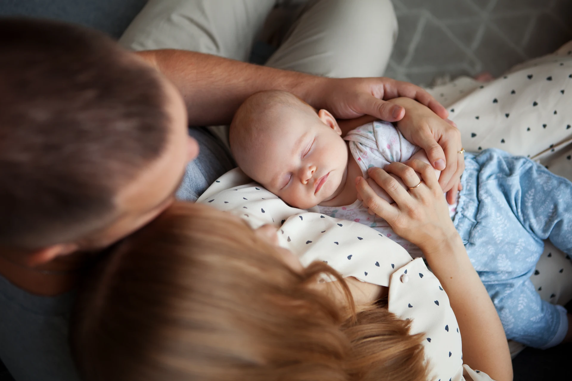 couple holding a baby together